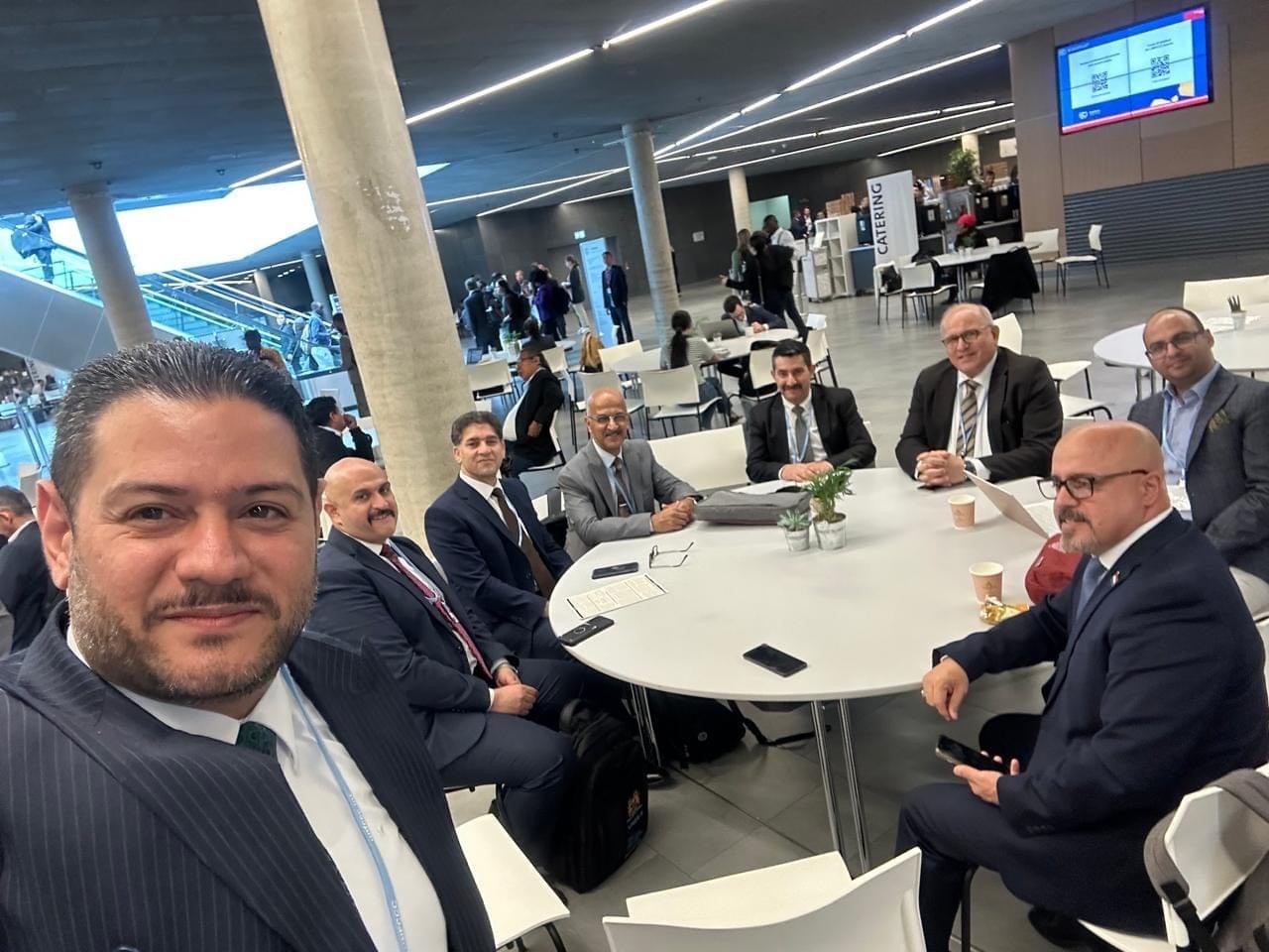 Iraqi delegates in discussion at the Bonn conference venue.